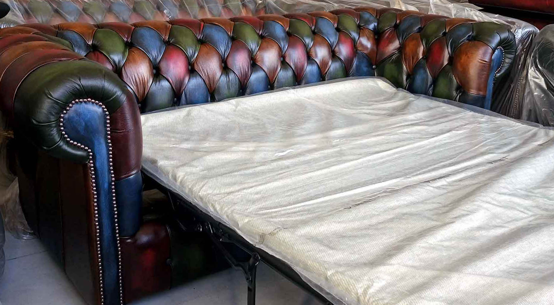 multicoloured patchwork chesterfield bed settee sofa leather